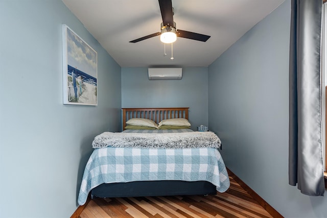 174 Kirk And Fitts Rd, Alburgh, VT 05440 - bedroom featuring a wall unit AC, wood finished floors, and a ceiling fan
