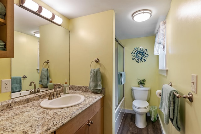 174 Kirk And Fitts Rd, Alburgh, VT 05440 - bathroom featuring wood finished floors, vanity, and shower / bath combination with glass door