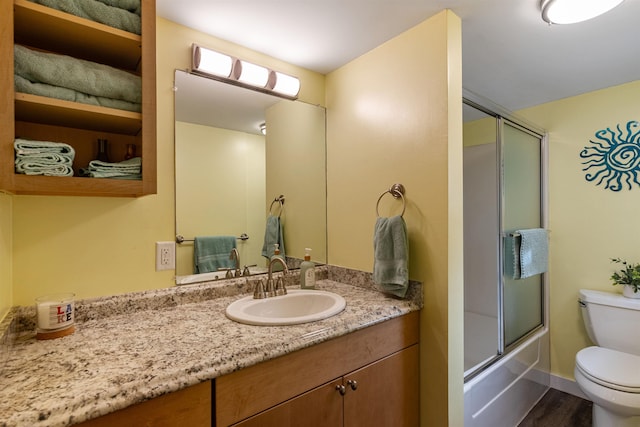 174 Kirk And Fitts Rd, Alburgh, VT 05440 - bathroom featuring vanity, wood finished floors, and shower / bath combination with glass door