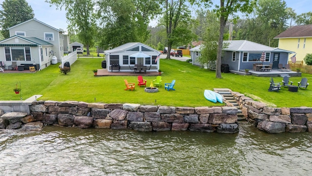 174 Kirk And Fitts Rd, Alburgh, VT 05440 - rear view of house with a fire pit, a patio area, and a water view