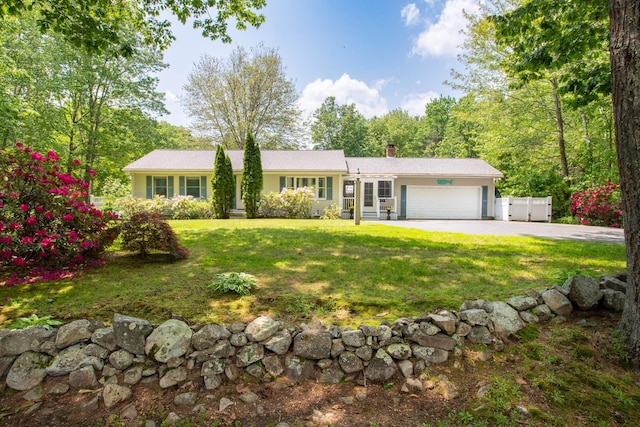 496 Coles Hill Rd, Wells, ME 04090 - ranch-style home featuring a garage, a chimney, a front lawn, and driveway