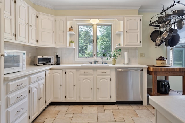 496 Coles Hill Rd, Wells, ME 04090 - kitchen featuring stainless steel dishwasher, white microwave, open shelves, crown molding, and backsplash