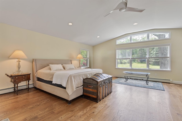 496 Coles Hill Rd, Wells, ME 04090 - bedroom featuring multiple windows, vaulted ceiling, light wood-type flooring, a baseboard heating unit, and recessed lighting