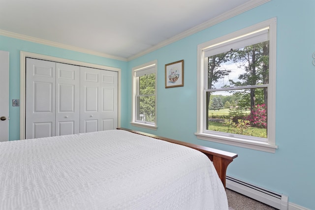496 Coles Hill Rd, Wells, ME 04090 - carpeted bedroom with a baseboard radiator, multiple windows, crown molding, and a closet