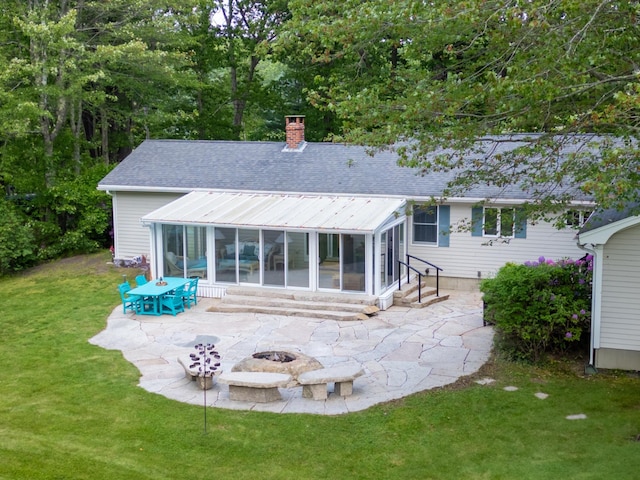 496 Coles Hill Rd, Wells, ME 04090 - back of property with a sunroom, a patio area, entry steps, and a chimney