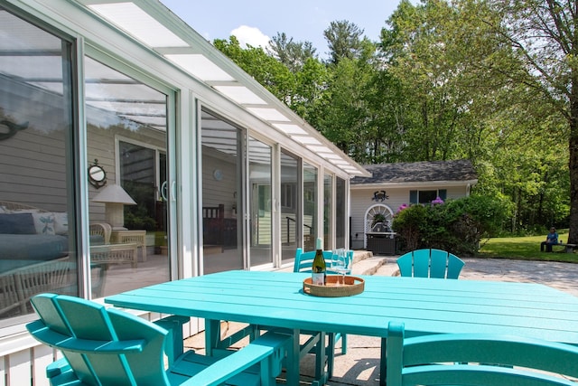496 Coles Hill Rd, Wells, ME 04090 - deck with a sunroom and outdoor dining space