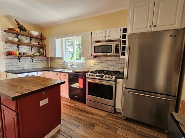 93 S Lincoln St, Keene, NH 03431 - kitchen featuring appliances with stainless steel finishes, butcher block countertops, open shelves, dark wood-type flooring, and backsplash