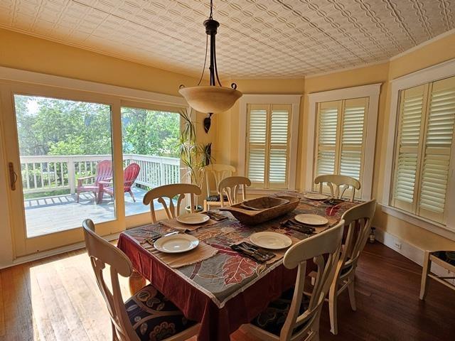 93 S Lincoln St, Keene, NH 03431 - dining room featuring an ornate ceiling, hardwood / wood-style flooring, and crown molding