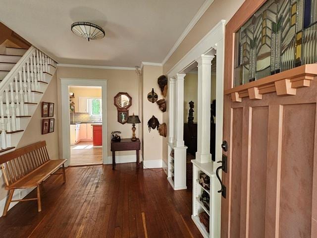 93 S Lincoln St, Keene, NH 03431 - entrance foyer featuring ornate columns, dark wood-style flooring, stairs, and crown molding