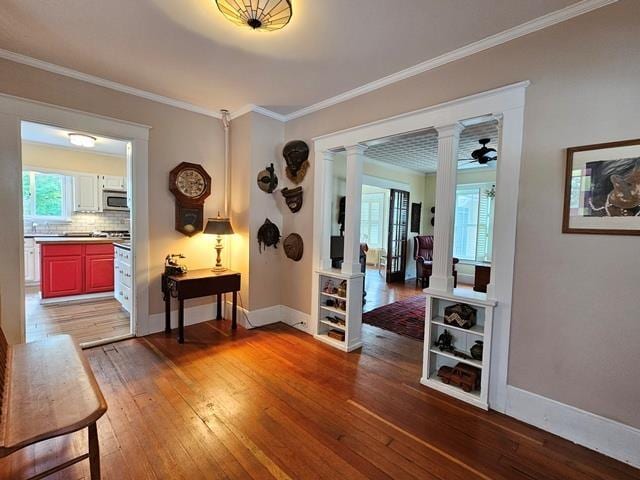 93 S Lincoln St, Keene, NH 03431 - hall featuring decorative columns, hardwood / wood-style floors, crown molding, and healthy amount of natural light