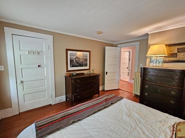93 S Lincoln St, Keene, NH 03431 - bedroom with wood finished floors, ornamental molding, and radiator