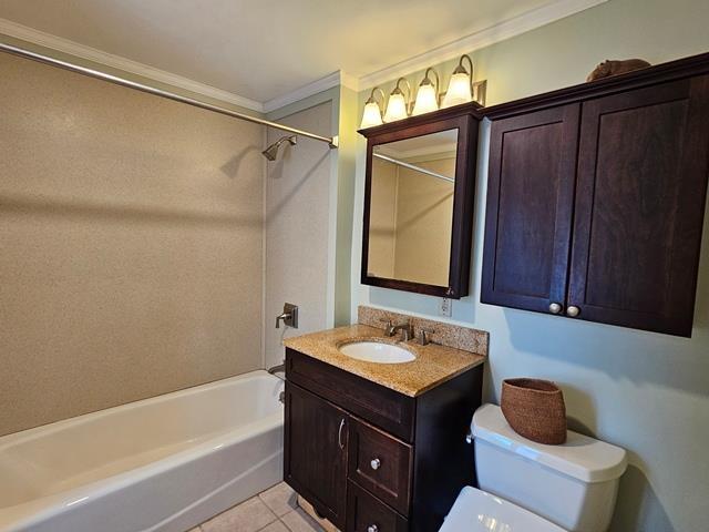 93 S Lincoln St, Keene, NH 03431 - bathroom with ornamental molding, vanity, washtub / shower combination, and tile patterned floors