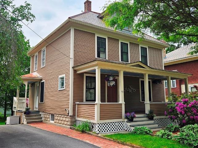 93 S Lincoln St, Keene, NH 03431 - traditional style home featuring a porch and a chimney