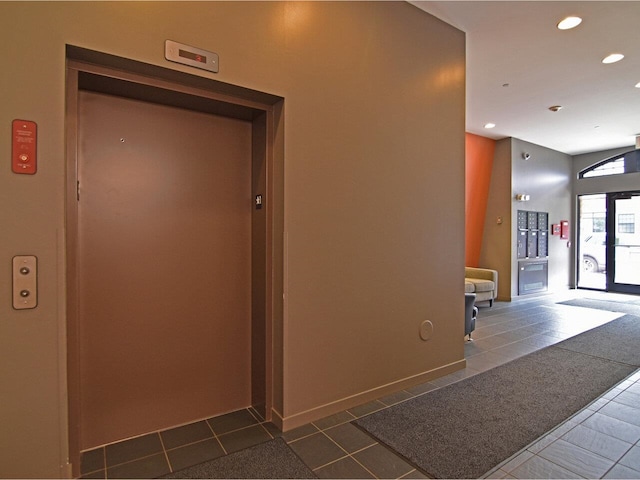 161 St Paul St Unit 202, Burlington, VT 05401 - corridor with elevator, dark tile patterned flooring, and recessed lighting
