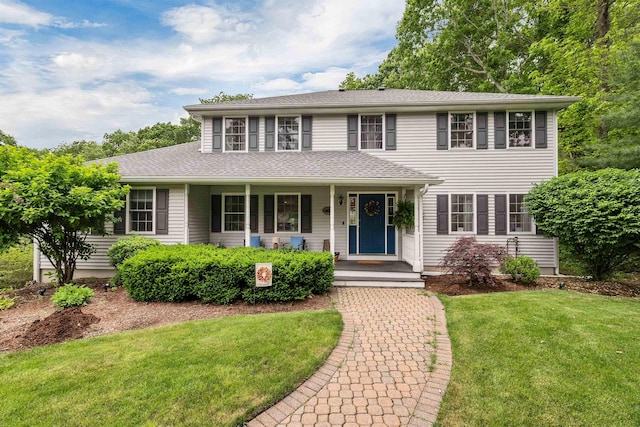 12 Julia Dr, Hooksett, NH 03106 - colonial house with a front yard, covered porch, and roof with shingles