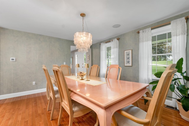 12 Julia Dr, Hooksett, NH 03106 - dining room featuring a chandelier, light wood-type flooring, and plenty of natural light