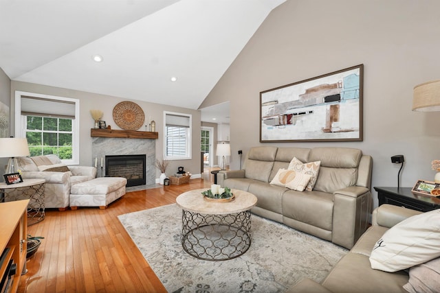 12 Julia Dr, Hooksett, NH 03106 - living room featuring hardwood / wood-style floors, healthy amount of natural light, a premium fireplace, high vaulted ceiling, and recessed lighting