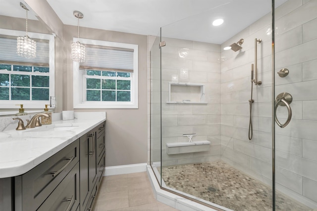 12 Julia Dr, Hooksett, NH 03106 - bathroom with a chandelier, vanity, a tile shower, tile patterned floors, and recessed lighting