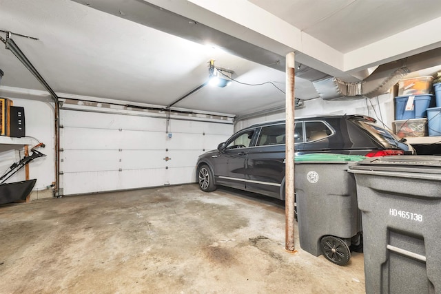 12 Julia Dr, Hooksett, NH 03106 - garage featuring a garage door opener
