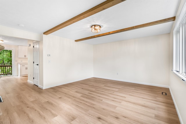 48 Eastmeadow Way, Manchester, NH 03109 - unfurnished room with beam ceiling and light wood-style floors