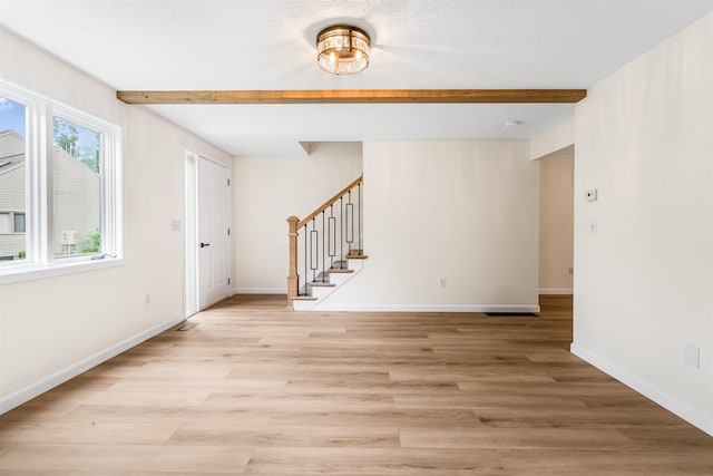 48 Eastmeadow Way, Manchester, NH 03109 - unfurnished room with stairs, light wood-style flooring, and beamed ceiling