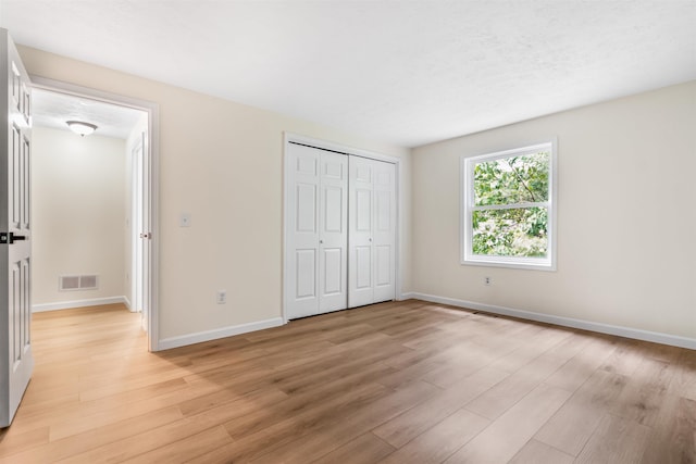 48 Eastmeadow Way, Manchester, NH 03109 - unfurnished bedroom featuring light wood-style flooring and a closet