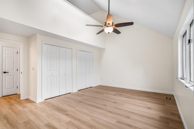48 Eastmeadow Way, Manchester, NH 03109 - unfurnished bedroom with lofted ceiling, two closets, light wood-type flooring, and ceiling fan
