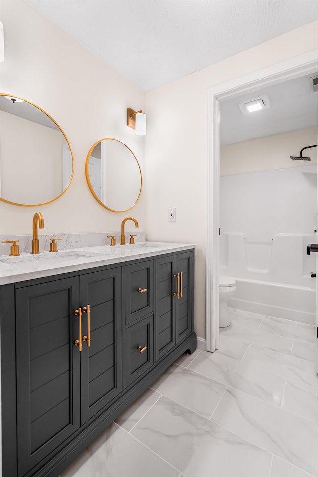 48 Eastmeadow Way, Manchester, NH 03109 - bathroom featuring double vanity, marble look tile flooring, and washtub / shower combination