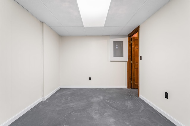 48 Eastmeadow Way, Manchester, NH 03109 - empty room with electric panel, concrete floors, and a paneled ceiling