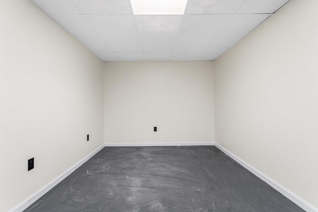 48 Eastmeadow Way, Manchester, NH 03109 - empty room with concrete flooring and a paneled ceiling