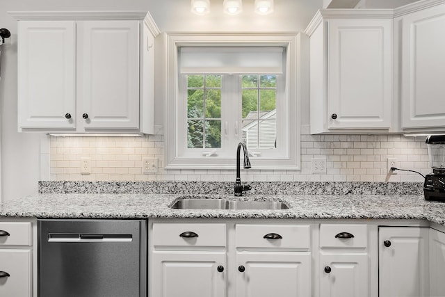 127 Hampton Mdws, Hampton, NH 03842 - kitchen with dishwasher, white cabinetry, and decorative backsplash