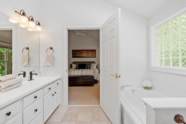 127 Hampton Mdws, Hampton, NH 03842 - bathroom with vanity, ensuite bathroom, a bath, a ceiling fan, and tile patterned flooring