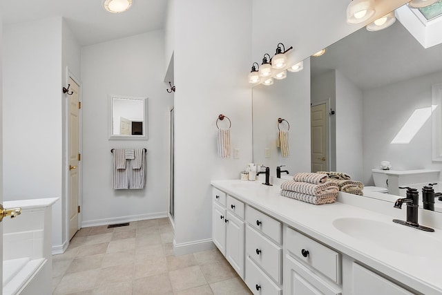 127 Hampton Mdws, Hampton, NH 03842 - full bathroom featuring a skylight, double vanity, and a bathtub