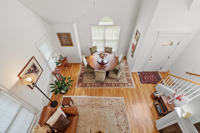 127 Hampton Mdws, Hampton, NH 03842 - dining area with wood finished floors and high vaulted ceiling
