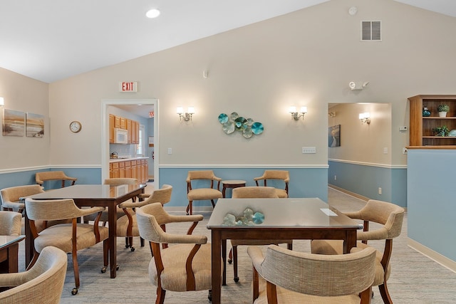 127 Hampton Mdws, Hampton, NH 03842 - dining space featuring high vaulted ceiling and light wood-style flooring