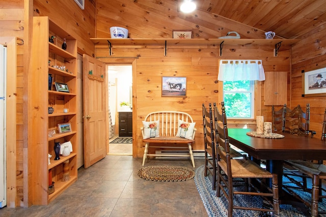 491 The Ln, Peacham, VT 05862 - dining room with vaulted ceiling, wooden walls, and wood ceiling