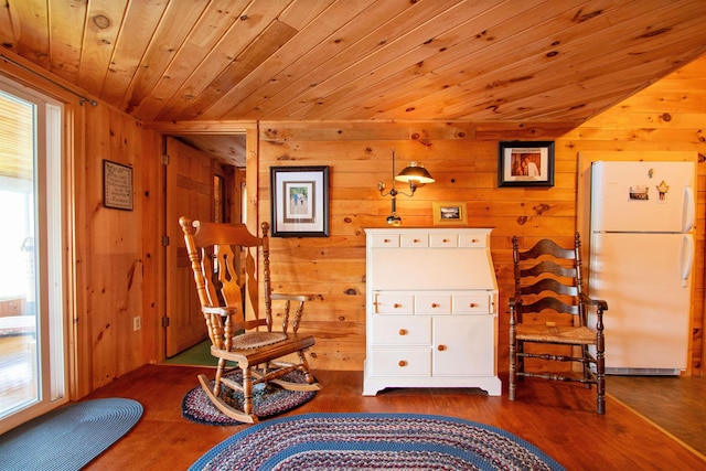 491 The Ln, Peacham, VT 05862 - living area with wooden walls, wooden ceiling, and wood finished floors