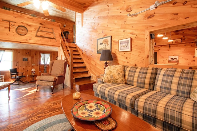 491 The Ln, Peacham, VT 05862 - living area featuring wood walls, wood finished floors, a ceiling fan, and stairs