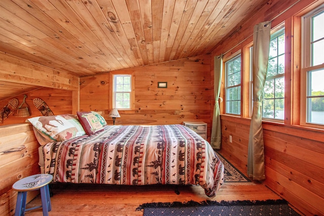 491 The Ln, Peacham, VT 05862 - bedroom with vaulted ceiling, wooden walls, hardwood / wood-style floors, and wooden ceiling