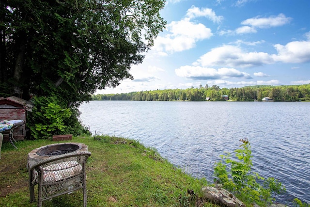 491 The Ln, Peacham, VT 05862 - water view featuring an outdoor fire pit and a heavily wooded area