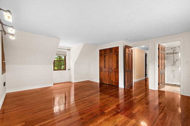 90 Giles Rd, East Kingston, NH 03827 - unfurnished living room featuring wood finished floors and baseboards