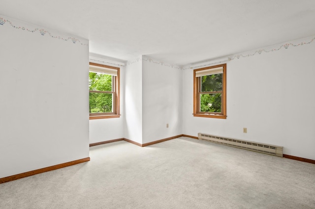 90 Giles Rd, East Kingston, NH 03827 - carpeted spare room featuring a baseboard radiator and baseboards