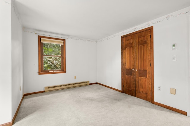 90 Giles Rd, East Kingston, NH 03827 - carpeted spare room with a baseboard radiator and baseboards