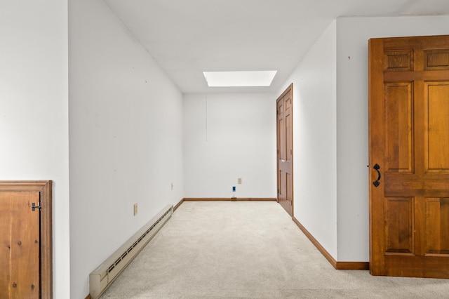 90 Giles Rd, East Kingston, NH 03827 - unfurnished bedroom featuring baseboard heating, a skylight, and carpet