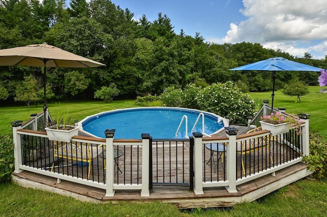 90 Giles Rd, East Kingston, NH 03827 - outdoor pool with a yard, a deck, and view of scattered trees