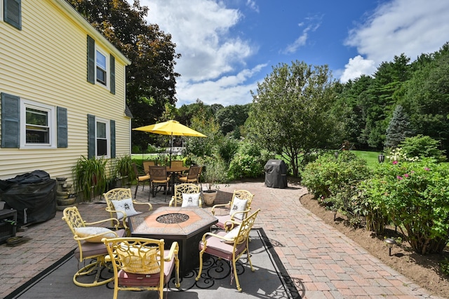 90 Giles Rd, East Kingston, NH 03827 - view of patio / terrace featuring outdoor dining space, a fire pit, and area for grilling