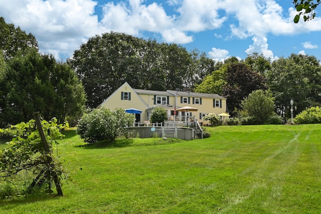 90 Giles Rd, East Kingston, NH 03827 - back of house with a yard and view of scattered trees