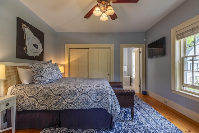 331 Rte 100 N, Plymouth, VT 05056 - bedroom with wood finished floors, a closet, and a ceiling fan