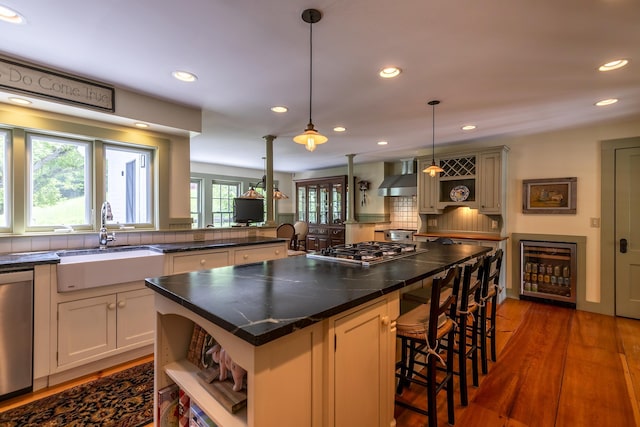 331 Rte 100 N, Plymouth, VT 05056 - kitchen featuring open shelves, wine cooler, wall chimney exhaust hood, appliances with stainless steel finishes, and recessed lighting