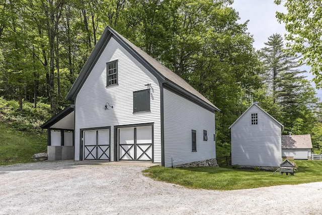 331 Rte 100 N, Plymouth, VT 05056 - garage featuring gravel driveway and view of scattered trees
